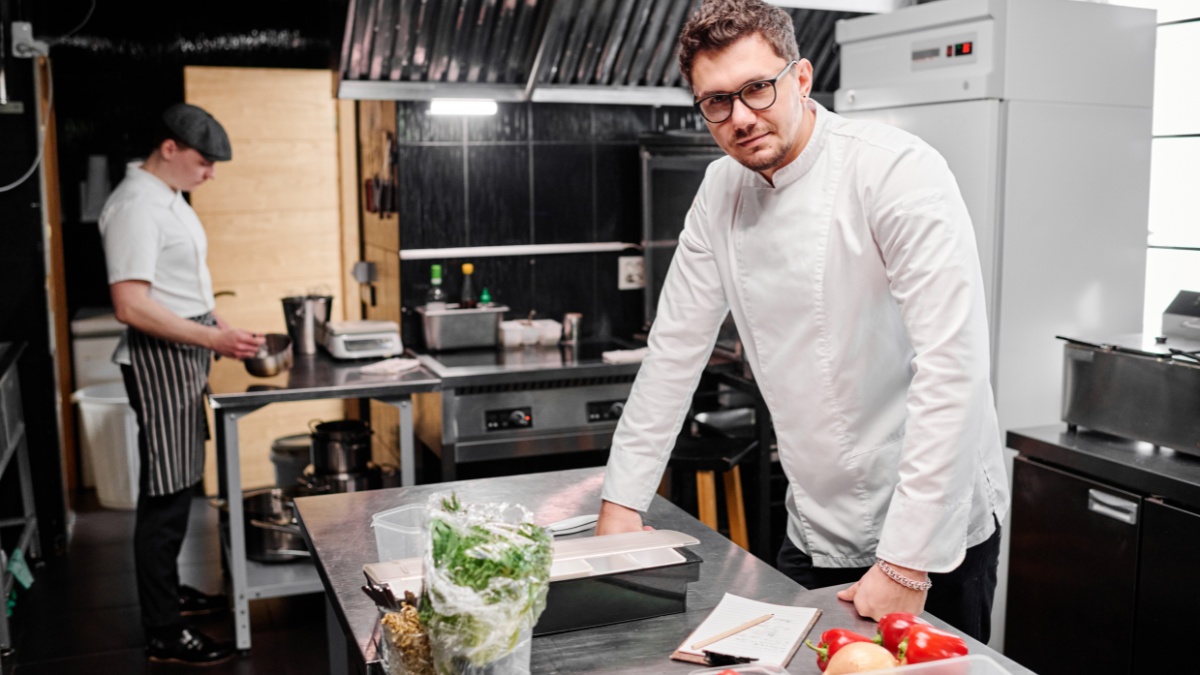 kitchen planning - chef standing in commercial kitchen