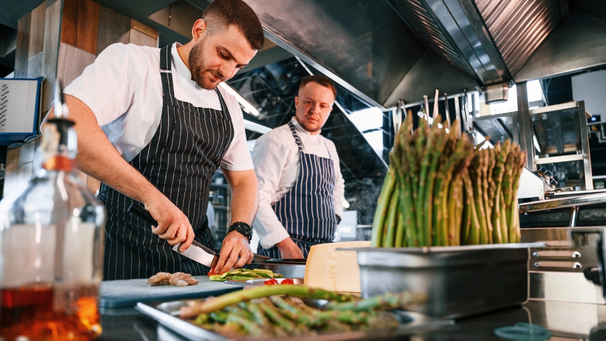 two chefs in restaurant kitchen