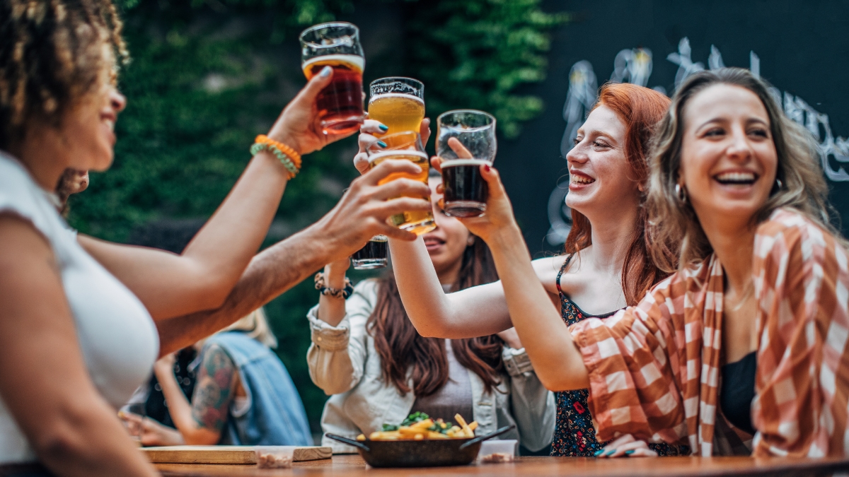 women at restaurant table with drinks